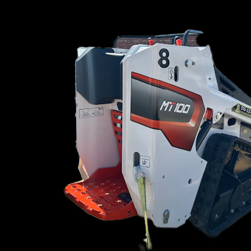 Close-up view of a white and orange Bobcat MT100 mini track loader, number 8 on its side, showing the operator standing platform and part of its tracks against a black background—offered by Carlisle Hardware in Carlisle, Iowa.